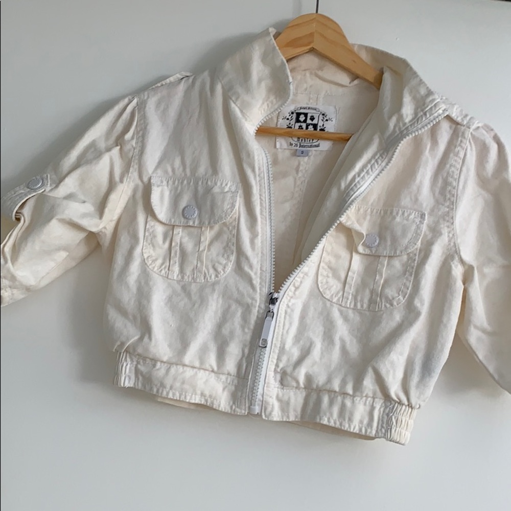 Cream Short bomber faux line.  Short sleeve.